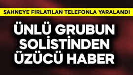 Ünlü grubun solistinden üzücü haber! Sahneye fırlatılan telefonla yaralandı