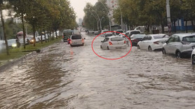 Diyarbakır'da güne damga vuran görüntü! Arabasına dolan suyu böyle boşalttı