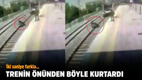 Trenin önüne atlayan kadını böyle kurtardı