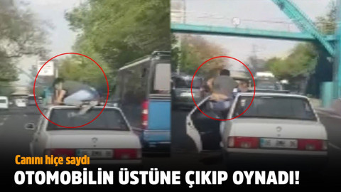 Hareket halindeki otomobilin üzerinde oynadı!