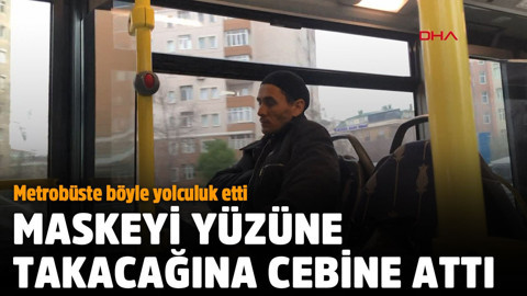 Maskeyi yüzüne takacağına cebine attı