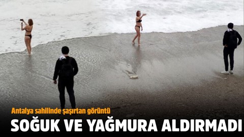 Soğuk hava, yağmur dinlemedi! Antalya sahilinde şaşırtan görüntü