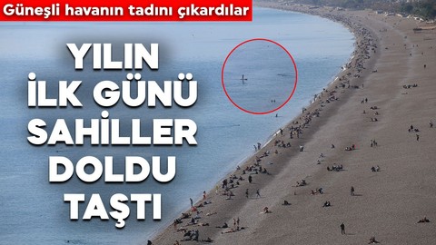 Yılın ilk günü Antalya'da sahiller doldu taştı! Güneşli havanın tadını çıkardılar