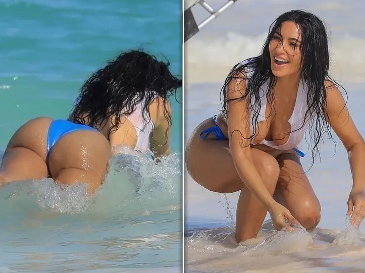 ABD'li ünlü televizyon yıldızı Kim Kardashian'ın plaj çekimlerinde verdiği göğüs dekoltesi ortalığı yaktı geçti! Eğilmesiyle olanlar oldu - Resim: 3